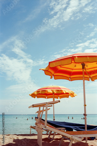 Beach umbrellas in Cefalu, Sicily beach