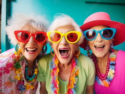 Happy and funny cool old three ladies wearing fashionable bright clothes. Happy and modern Senior women.  photo