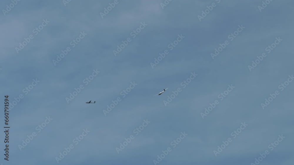 A glider (sailplane) flying in the sky. A glider (sailplane) flying in the sky.