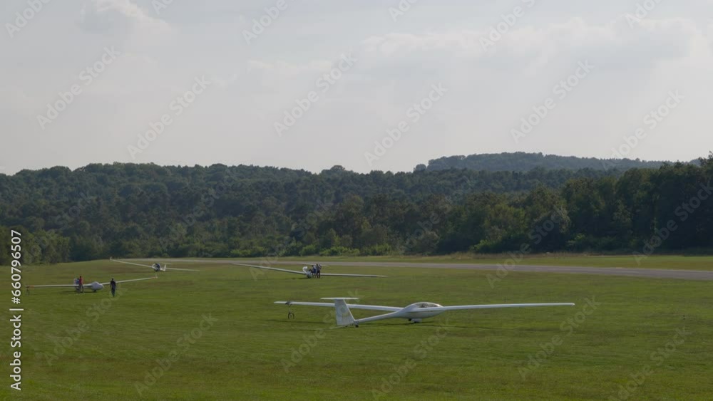 Glider (sailplane) ready for takeoff on an airfield in the hills. Glider (sailplane) ready for takeoff on an airfield in the hills.