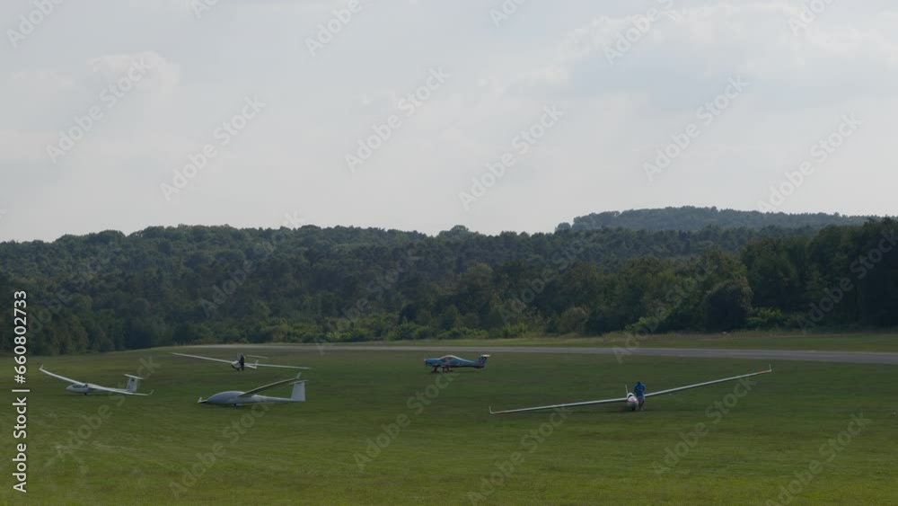 Glider (sailplane) ready for takeoff on an airfield in the hills. Glider (sailplane) ready for takeoff on an airfield in the hills.