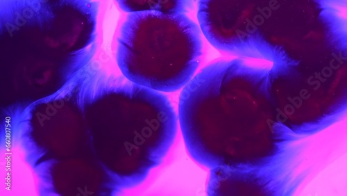 Obraz na płótnie Dark blue ink mixing in vibrant colored neon water creating stains, abstract background wallpaper