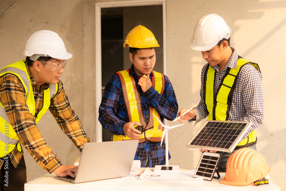 Workers and engineers are talking about installing a solar panel system. Solar panel technician installs solar panels on the roof. alternative energy concepts Workers and engineers are talking about installing a solar panel system. Solar panel technician installs solar panels on the roof. alternative energy concepts