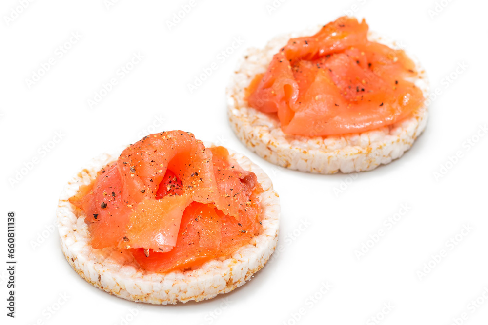 Tasty Rice Cake Sandwiches with Fresh Salmon Slices Isolated on White. Easy Breakfast and Diet Food. Crispbread with Red Fish. Healthy Dietary Snacks - Isolation