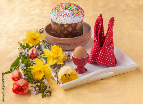 Easter breakfast with flowers, Easter cake and egg. photo