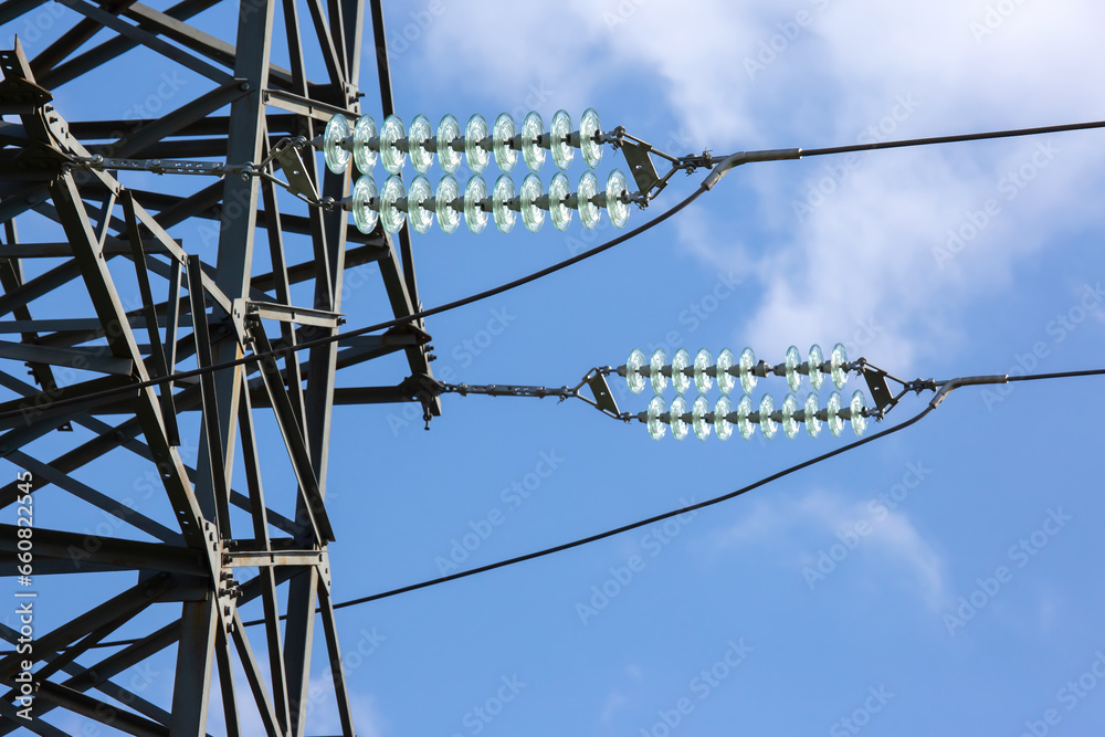 High voltage tower with electrical voltage wires isolates close-up ...