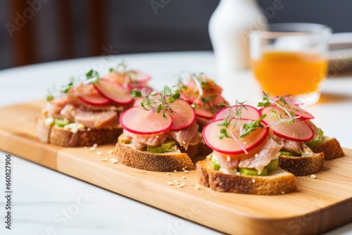 tuna bruschetta with a side of pickles and radishes