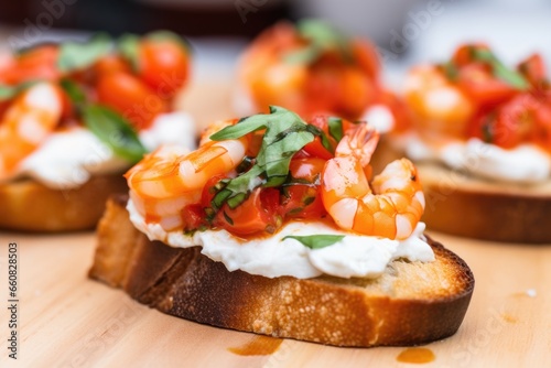 close-up of shrimp resting on a toasted bruschetta slice