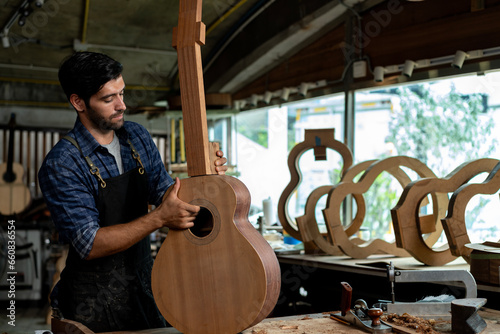 Obraz na płótnie Guitar Luthier Aligns Guitar Neck on Body with Precision Ruler