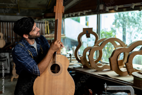 Obraz na plátně Guitar Luthier Aligns Guitar Neck on Body with Precision Ruler
