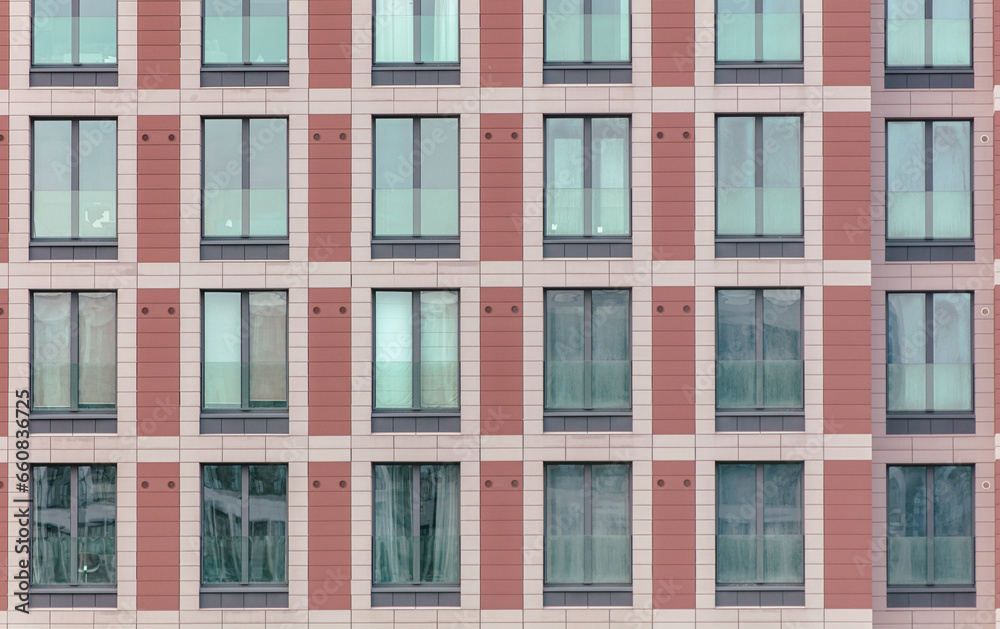 Fototapeta premium The walls of a multi-story building as a background. Texture