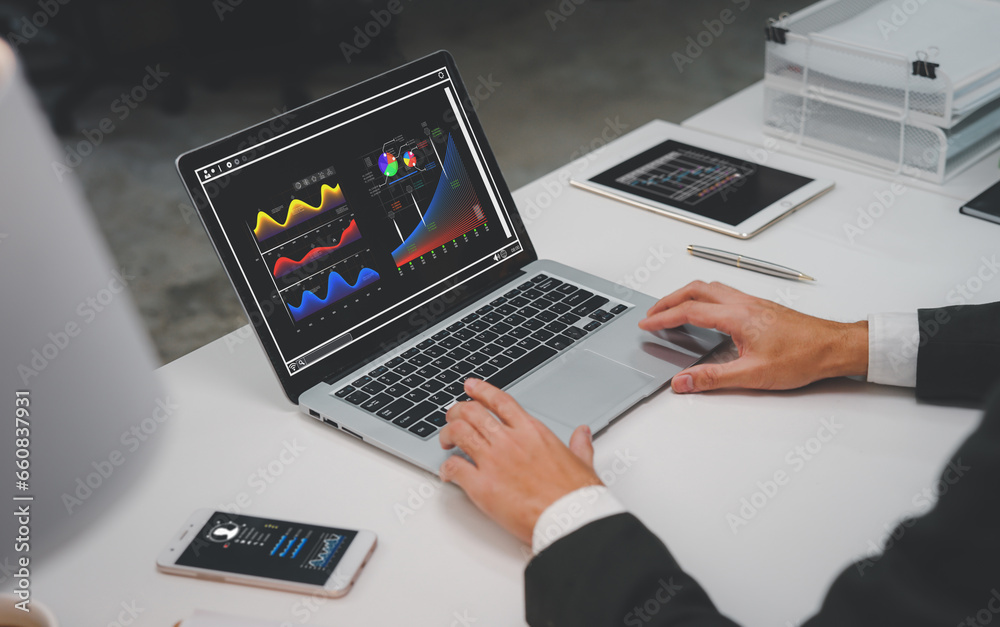 A man holding holographic graphs and stock market statistics gain profits. Concept of growth planning and business strategy. Corporate strategy for finance, operations, sales, marketing.
A man holding holographic graphs and stock market statistics gain profits. Concept of growth planning and business strategy. Corporate strategy for finance, operations, sales, marketing.