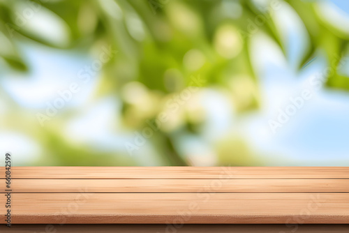 Empty wooden table with natural green background for product display