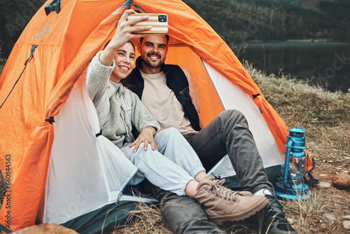 Couple, tent and camping selfie with smile, memory and holiday, web blog and morning in countryside. Man, woman and relax with vacation, social media post and adventure with love, outdoor and freedom