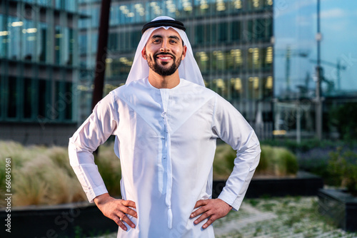Canvas Print Arab middle-eastern man wearing emirati kandora traditional clothing in the city - Arabian muslim businessman strolling in urban business centre
