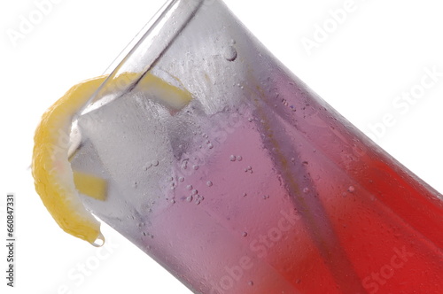 Lemon peel raspberry Cocktail Mocktail shot against a white background with props and garnish