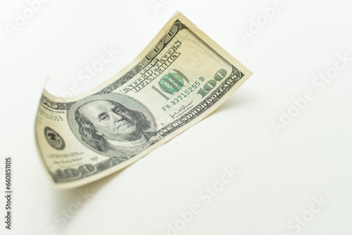 Close up hundred dollar banknote on white background