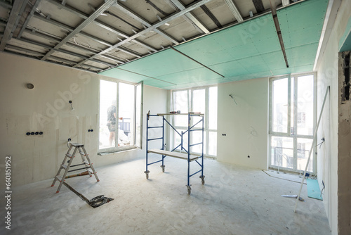 Drywall installation work in progress by construction workers at construction room. easiest and cheapest way to do partition for interior wall. New home for under construction. protection building 