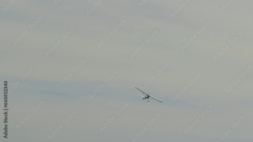 A propeller plane flying in the sky after towing a glider. A propeller plane flying in the sky after towing a glider.