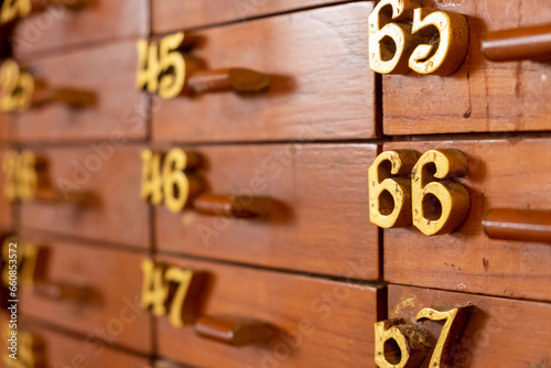 old wooden cabinet with numbering drawers