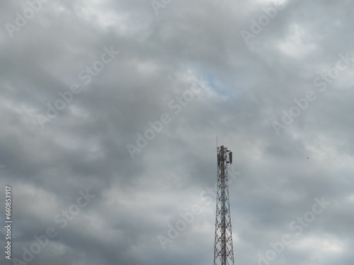 signal transmitter pole stands firm when it's cloudy
