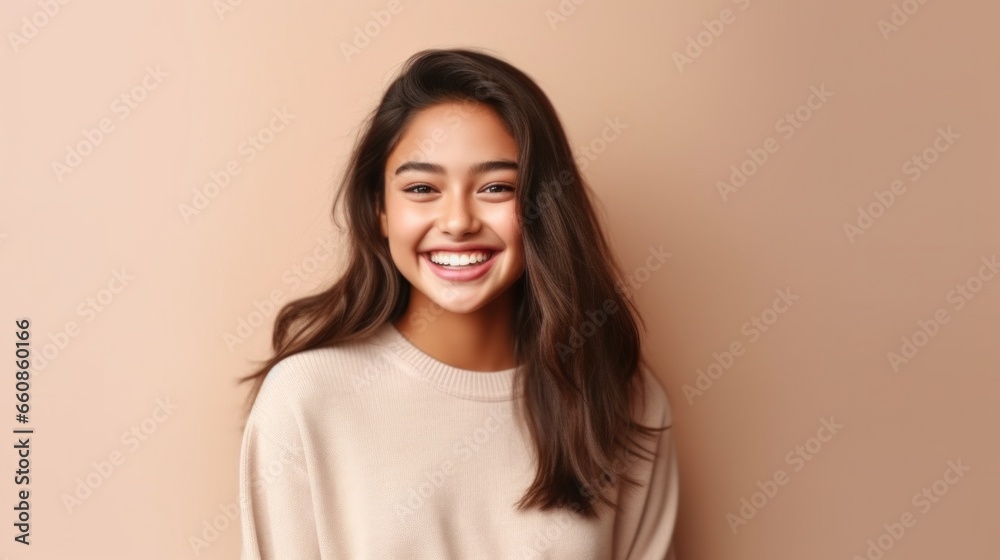 A beaming teen girl stands out against the studio's muted background, her cheerful expression reflecting the optimism of youth. A beaming teen girl stands out against the studio's muted background, her cheerful expression reflecting the optimism of youth.