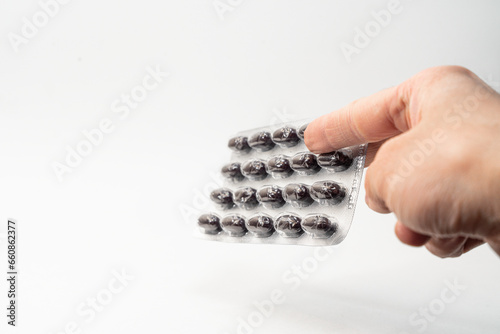 man holding a tablets. pills
