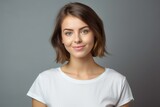 Portrait of a beautiful fictional young white woman with a pretty smile isolated on a plain background. Generative AI. 
