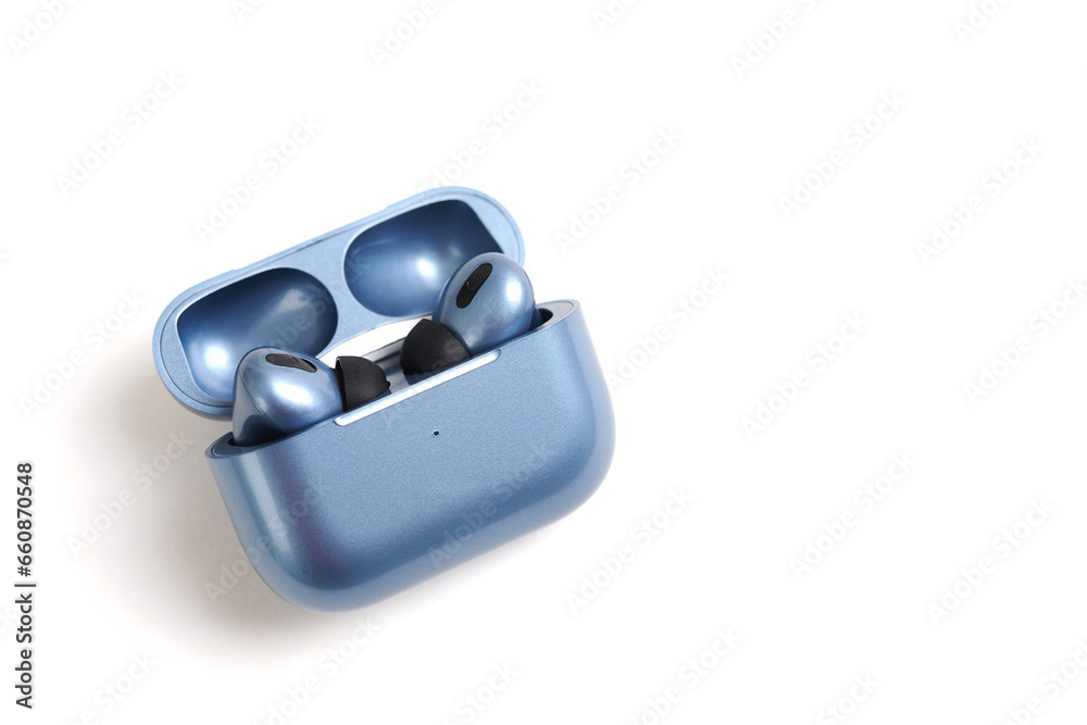 Blue modern headphones wireless earphones with case, isolated on white background Blue modern headphones wireless earphones with case, isolated on white background