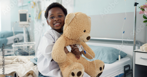 Obraz na plátně African boy child, hospital and teddy bear on bed with face, smile and rest for recovery for healthcare treatment