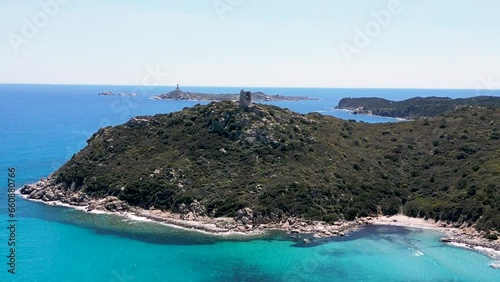 Drone shot of the ruins of the Saracen Tower on the beach of Cala Porto Giunco in Cagliari, Italy photo