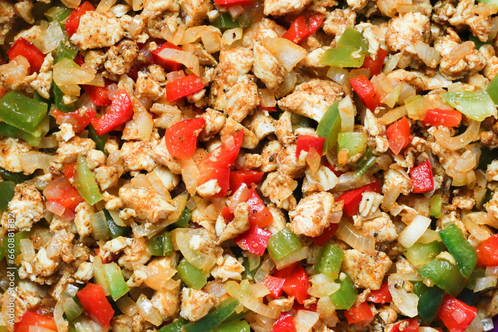 Marinated chicken in spices texture. Gyros dish recipe. Chopped bell pepper. Cut paprika pieces. Colorful chicken salad background. Closeup ingredients texture. Vibrant color ripe vegetables. Marinated chicken in spices texture. Gyros dish recipe. Chopped bell pepper. Cut paprika pieces. Colorful chicken salad background. Closeup ingredients texture. Vibrant color ripe vegetables.