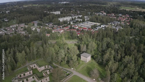 Drone footage of the Ruins of Old Vaasa and the urban buildings in the background in Vaasa, Finland photo