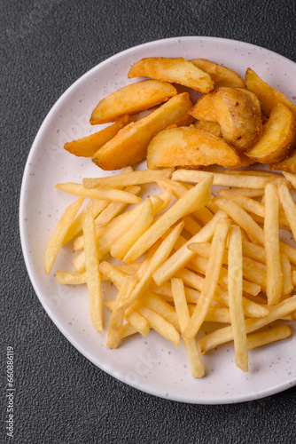 Fresh delicious crispy French fries with salt and spices