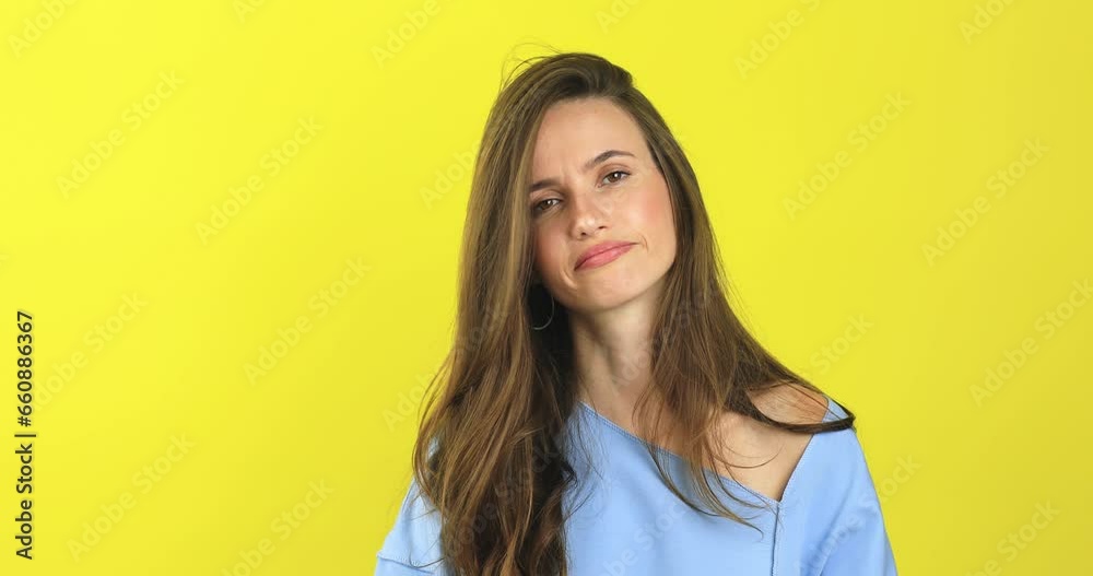Its enough, stop it. Young displeased woman with brunette hair feeling bored and annoyed, and gesture no, showing fed up gesture, yellow studio background. Its enough, stop it. Young displeased woman with brunette hair feeling bored and annoyed, and gesture no, showing fed up gesture, yellow studio background.