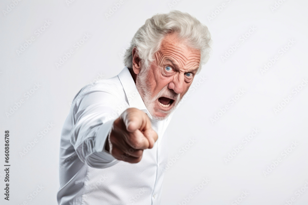 Senior man with furious expression and outstretched finger convey a sense of anger. Isolated on white background. Generative Ai Senior man with furious expression and outstretched finger convey a sense of anger. Isolated on white background. Generative Ai