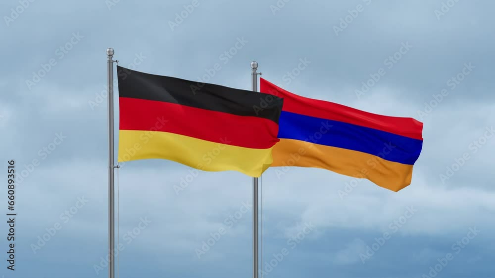 Armenia and Germany flag waving together on cloudy sky, endless seamless loop, two country cooperation concept Armenia and Germany flag waving together on cloudy sky, endless seamless loop, two country cooperation concept