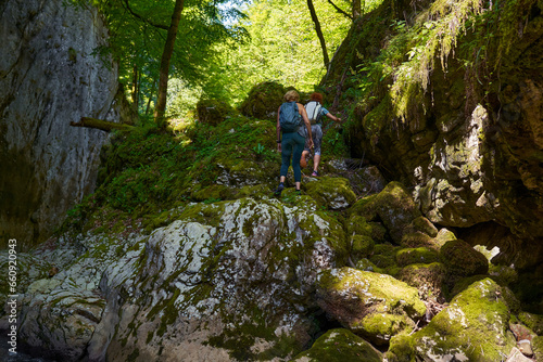 Woman hikers exploring a gorge