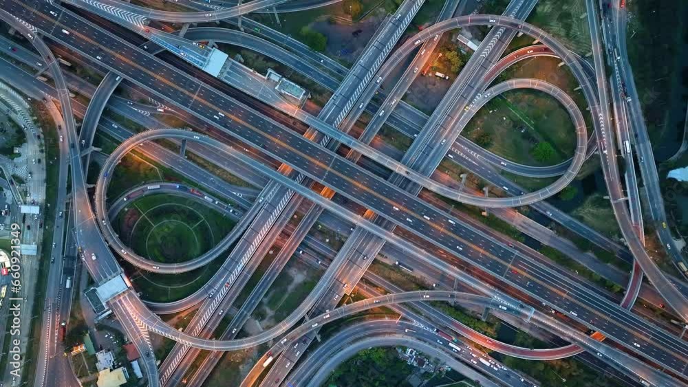 Title	
Aerial view of interchange and motorway road. transportation concept. night traffic time lapse. hyperlapse. Bangkok, Thailand	