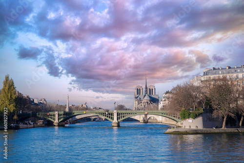 Paris, the Sully bridge on the Seine, and the Notre-Dame cathedral in background 