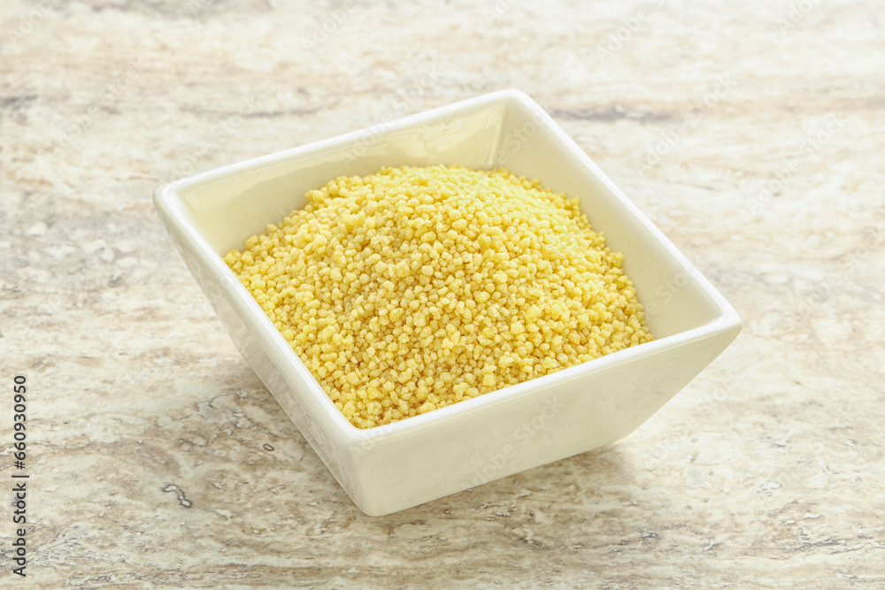 Raw couscous in the bowl Raw couscous in the bowl