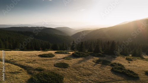 Drone shot of a scenic sunset over a mountain forest, Rila, Bulgaria photo