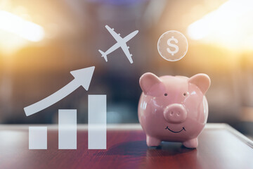 happy piggy bank on blur cabin for saving flight ticket low cost good value saving money business travel trip concept