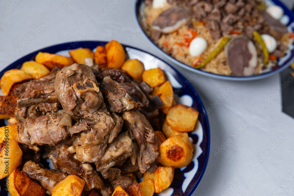 Kazakh beshparmak with meat and fried potato, oriental beshparmak, grilled lamb with fried potato, oriental cuisine, asian cuisine, traditional oriental dish Kazakh beshparmak with meat and fried potato, oriental beshparmak, grilled lamb with fried potato, oriental cuisine, asian cuisine, traditional oriental dish