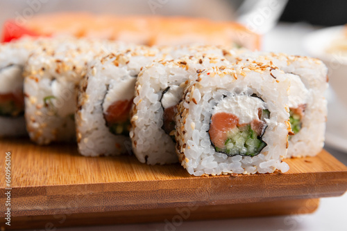 Canvas Print set of sushi rolls on wooden desk close up