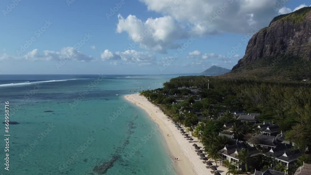 Le Morne tropical beach and famous kite, surf spot aerial panoramic view with palm trees and white sand blue ocean and sunbeds with umbrellas, Mauritius Le Morne tropical beach and famous kite, surf spot aerial panoramic view with palm trees and white sand blue ocean and sunbeds with umbrellas, Mauritius