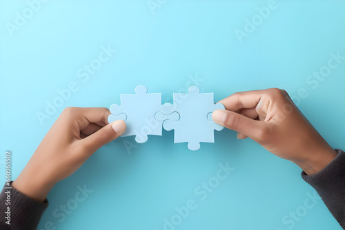 Piecing Together Success A Conceptual Image of Business, with Hands Holding a Jigsaw Puzzle on a Pastel Blue Background
