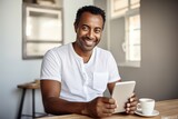 adult african american man works in the office with a smartphone and coffee. positive man working on smartphone, modern technology