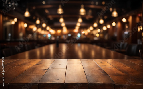 Empty wooden table and Coffee shop blur background with bokeh lights © UN