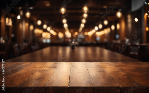 Empty wooden table and Coffee shop blur background with bokeh lights